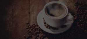Grumpy Goat Coffee Roastery Coffee Beans and mug Background Image